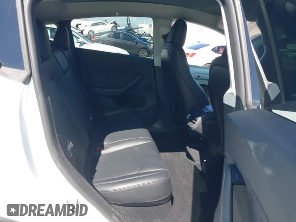 2023 Tesla Model Y Long Range with VIN 7SAYGDEEXPA129790, listed as a IAAI auction lot 41735721 with 20,402 mi miles and . Bid and sale history available at DreamBid. Image 8.