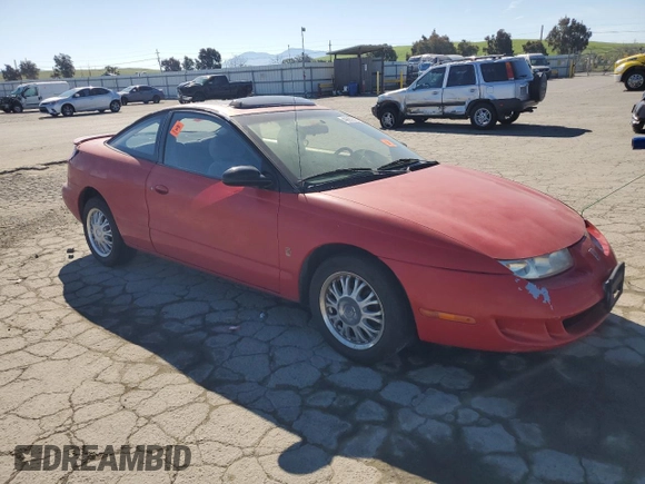 1999 Saturn SC z VIN 1G8ZY127XXZ314531, wystawiony jako Copart lot #49653805 z przebiegiem 130 457 mil mil oraz Szkody całkowita. Historia ofert i sprzedaży dostępna na DreamBid. Obrazek 4.