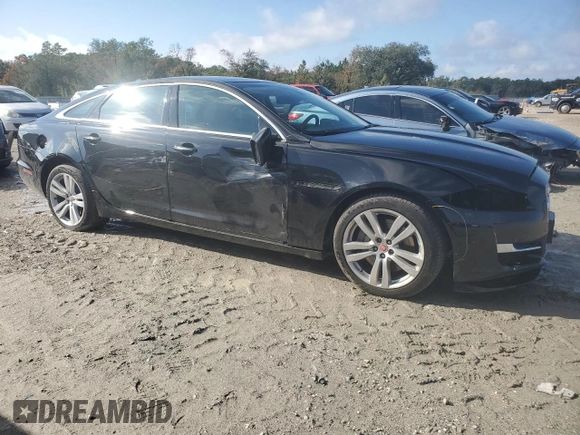 2016 Jaguar XJ Portfolio with VIN SAJWJ2GDXG8W03143, listed as a Copart auction lot 86467114 with 42,923 mi miles and Salvage title. Bid and sale history available at DreamBid. Image 4.