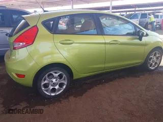 2011 Ford Fiesta SES with VIN 3FADP4FJ9BM119319, listed as a IAAI auction lot 42025691 with 104,516 mi miles. Bid and sale history available at carsss.com. Image 4.