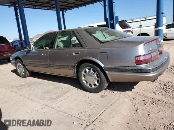 1997 Cadillac Seville Luxury SLS z VIN 1G6KS52Y5VU815770, wystawiony jako Copart lot #88555205 z przebiegiem 92 459 mil mil oraz Czysty tytuł • Clean title. Historia ofert i sprzedaży dostępna na DreamBid. Obrazek 2.