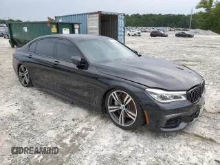 2019 BMW 7 Series 750i with VIN WBA7F0C57KGM25906, listed as a Copart auction lot 62728443 with 61,561 mi miles. Bid and sale history available at carsss.com. Image 4.
