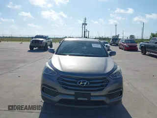 2017 Hyundai Santa Fe 2.4L z VIN 5XYZTDLB7HG444033, wystawiony jako IAAI lot #42263907 z przebiegiem 107 454 mil mil oraz . Historia ofert i sprzedaży dostępna na DreamBid. Obrazek 12.