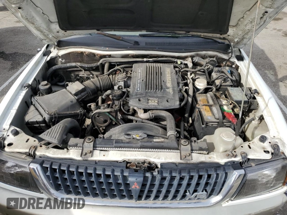 1999 Mitsubishi Montero LS z VIN JA4LS31H2XP037110, wystawiony jako Copart lot #45447485 z przebiegiem 166 942 mil mil oraz Szkoda całkowita • Salvage title. Historia ofert i sprzedaży dostępna na DreamBid. Obrazek 12.