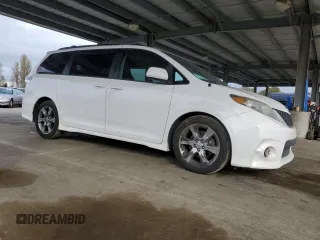 2012 Toyota Sienna SE with VIN 5TDXK3DC9CS215991, listed as a Copart auction lot 51868005 with 215,075 mi miles and Salvage title. Bid and sale history available at DreamBid. Image 4.