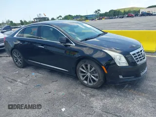 2013 Cadillac XTS z VIN 2G61N5S3XD9114872, wystawiony jako IAAI lot #42273359 z przebiegiem 161 944 mil mil oraz . Historia ofert i sprzedaży dostępna na DreamBid. Obrazek 1.