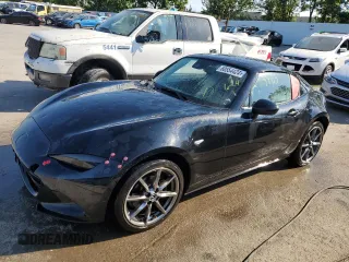 2021 Mazda MX-5 Miata Grand Touring z VIN JM1NDAM79M0456429, wystawiony jako Copart lot #60554424 z przebiegiem 35 127 mil mil oraz Szkoda całkowita • Salvage title. Historia ofert i sprzedaży dostępna na DreamBid. Obrazek 1.