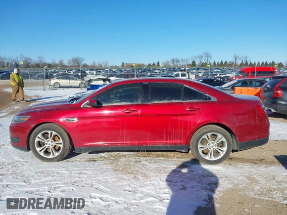 2015 Ford Taurus SEL z VIN 1FAHP2E85FG163421, wystawiony jako IAAI lot #41320489 z przebiegiem 165 618 mil mil oraz . Historia ofert i sprzedaży dostępna na DreamBid. Obrazek 14.