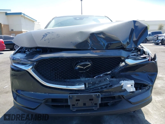 2018 Mazda CX-5 Grand Touring z VIN JM3KFADM7J0327272, wystawiony jako IAAI lot #42279536 z przebiegiem 97 478 mil mil oraz . Historia ofert i sprzedaży dostępna na DreamBid. Obrazek 12.