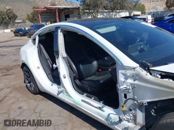 2018 Tesla Model 3 Long Range Battery with VIN 5YJ3E1EAXJF108781, listed as a IAAI auction lot 41962628 with 61,208 mi miles and . Bid and sale history available at DreamBid. Image 6.