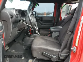 2014 Jeep Wrangler Unlimited Sport with VIN 1C4BJWDG4EL115321, listed as a Copart auction lot 51297255 with 176,685 mi miles and Salvage Title. Bid and sale history available at carsss.com. Image 7.