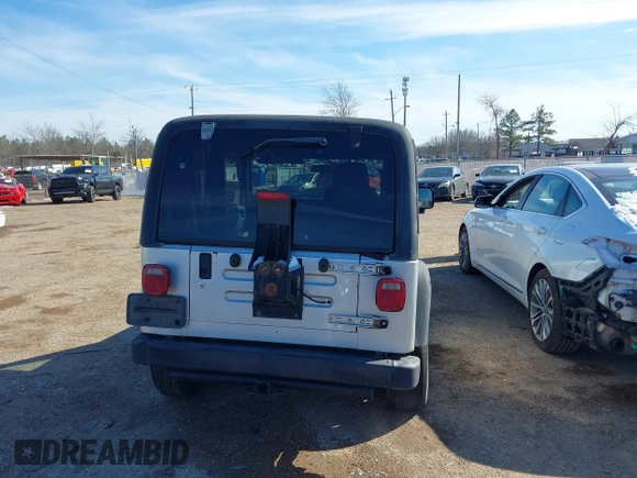 2004 Jeep Wrangler Sport Right Hand Drive with VIN 1J4F449SX4P780560, listed as a IAAI auction lot 41645721 with 146,681 mi miles. Bid and sale history available at carsss.com. Image 16.