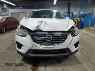 2016 Mazda CX-5 Sport with VIN JM3KE4BY9G0694709, listed as a Copart auction lot 55147555 with 98,900 mi miles and Salvage title. Bid and sale history available at DreamBid. Image 5.