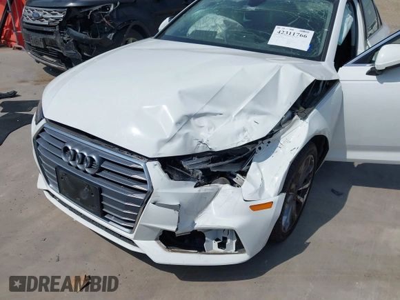 2019 Audi A4 Premium z VIN WAUGMAF48KN007428, wystawiony jako IAAI lot #42311766 z przebiegiem 65 249 mil mil oraz . Historia ofert i sprzedaży dostępna na DreamBid. Obrazek 6.