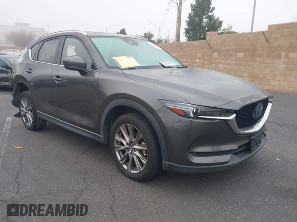2021 Mazda CX-5 Grand Touring with VIN JM3KFADM2M1340669, listed as a IAAI auction lot 41916687 with 83,872 mi miles. Bid and sale history available at carsss.com. Image 1.