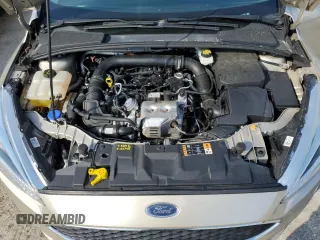 2018 Ford Focus SE z VIN 1FADP3FE8JL331853, wystawiony jako Copart lot #74013984 z przebiegiem 73 237 mil mil oraz Szkoda całkowita • Salvage title. Historia ofert i sprzedaży dostępna na DreamBid. Obrazek 12.