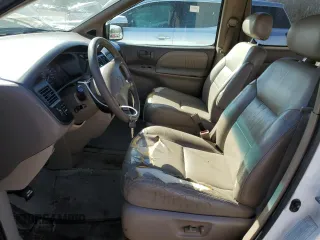 1999 Toyota Sienna LE with VIN 4T3ZF13C0XU144476, listed as a Copart auction lot 48185235 with 183,940 mi miles and Salvage title. Bid and sale history available at DreamBid. Image 7.