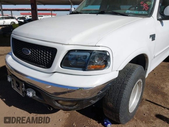 1999 Ford F-150 XL with VIN 2FTRX18L9XCA21004, listed as a IAAI auction lot 41616300 with 186,620 mi miles. Bid and sale history available at carsss.com. Image 6.