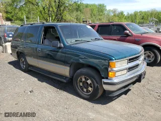 1999 Chevrolet Tahoe with VIN 1GNEC13R2XJ536828, listed as a Copart auction lot 53610465 with 201,276 mi miles and Salvage Title. Bid and sale history available at carsss.com. Image 4.