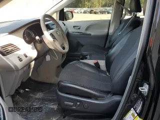 2014 Toyota Sienna SE with VIN 5TDXK3DC5ES418508, listed as a Copart auction lot 69742974 with 210,168 mi miles and Salvage Title. Bid and sale history available at DreamBid. Image 7.