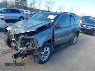 2005 GMC Envoy SLE with VIN 1GKDT13S852362380, listed as a IAAI auction lot 42031727 with 76,711 mi miles. Bid and sale history available at carsss.com. Image 18.