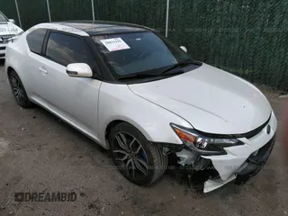 2015 Scion tC with VIN JTKJF5C75F3096734, listed as a IAAI auction lot 30811195 with 88,879 mi miles. Bid and sale history available at carsss.com. Image 1.