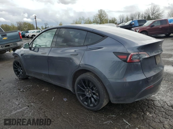 2023 Tesla Model Y Long Range z VIN 7SAYGDEE1PF937867, wystawiony jako Copart lot #51615195 z przebiegiem 88 912 mil mil oraz Szkoda całkowita • Salvage title. Historia ofert i sprzedaży dostępna na DreamBid. Obrazek 2.