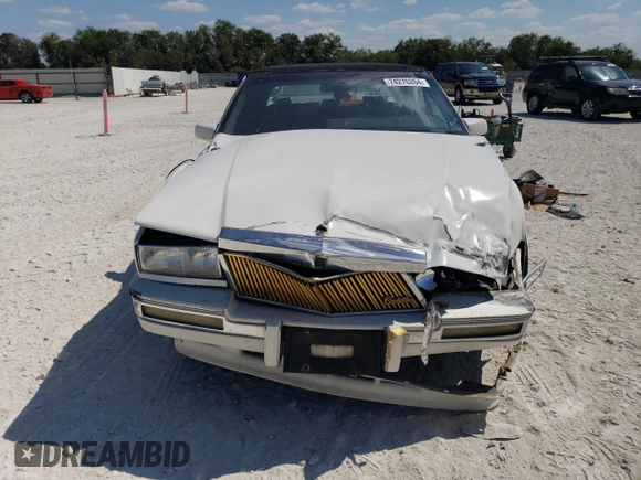 1991 Cadillac Seville z VIN 1G6KS53B9MU824142, wystawiony jako Copart lot #74276264 z przebiegiem 103 517 mil mil oraz Szkody całkowita. Historia ofert i sprzedaży dostępna na DreamBid. Obrazek 5.