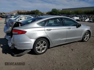 2018 Ford Fusion SE z VIN 3FA6P0LU7JR139974, wystawiony jako Copart lot #69819394 z przebiegiem 164 123 mil mil oraz Szkoda całkowita • Salvage title. Historia ofert i sprzedaży dostępna na DreamBid. Obrazek 3.