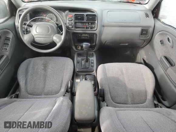 1999 Suzuki Grand Vitara JLX z VIN JS3TD62V6X4108950, wystawiony jako Copart lot #46468705 z przebiegiem 215 541 mil mil oraz Szkoda całkowita • Salvage title. Historia ofert i sprzedaży dostępna na DreamBid. Obrazek 8.