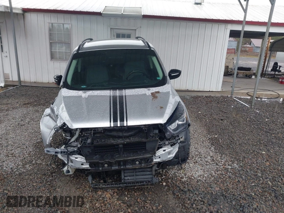 2018 Ford Escape SE z VIN 1FMCU9GD1JUB35184, wystawiony jako IAAI lot #41611285 z przebiegiem 142 267 mil mil oraz . Historia ofert i sprzedaży dostępna na DreamBid. Obrazek 13.
