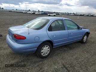 1995 Ford Contour z VIN 1FALP65L7SK244644, wystawiony jako Copart lot #51668445 z przebiegiem 100 085 mil mil oraz Szkody całkowita. Historia ofert i sprzedaży dostępna na DreamBid. Obrazek 3.