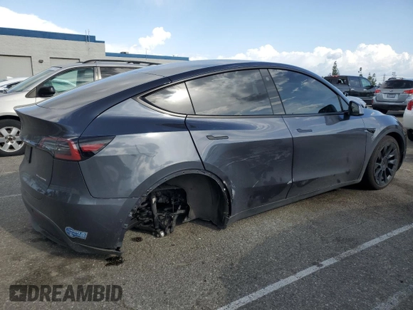 2021 Tesla Model Y Long Range with VIN 5YJYGDEE6MF200883, listed as a Copart auction lot 51707405 with 59,820 mi miles and Salvage Title. Bid and sale history available at DreamBid. Image 3.