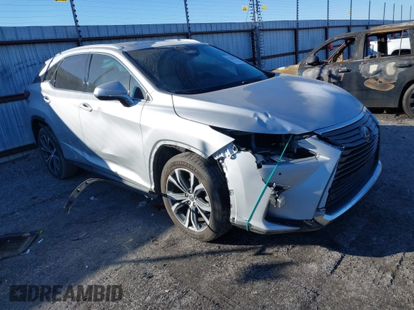 2018 Lexus RX 350 z VIN 2T2ZZMCA6JC096728, wystawiony jako IAAI lot #41356629 z przebiegiem 76 982 mil mil oraz . Historia ofert i sprzedaży dostępna na DreamBid. Obrazek 1.