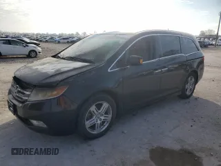 2012 Honda Odyssey Touring with VIN 5FNRL5H9XCB022284, listed as a Copart auction lot 82766824 with Not provided miles and Salvage title. Bid and sale history available at DreamBid. Image 1.