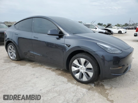2024 Tesla Model Y Long Range with VIN 7SAYGDEE3RA253354, listed as a Copart auction lot 50524105 with 10,353 mi miles and Salvage Title. Bid and sale history available at DreamBid. Image 4.