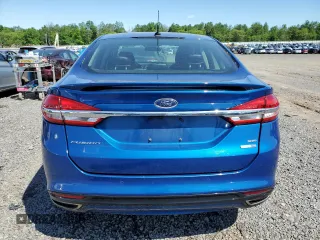2017 Ford Fusion SE z VIN 3FA6P0T9XHR303675, wystawiony jako Copart lot #57134985 z przebiegiem 130 964 mil mil oraz Tytuł czysty. Historia ofert i sprzedaży dostępna na DreamBid. Obrazek 6.