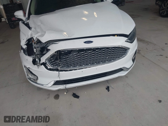 2019 Ford Fusion Titanium with VIN 3FA6P0K95KR271291, listed as a IAAI auction lot 41983320 with 71,962 mi miles and . Bid and sale history available at DreamBid. Image 18.
