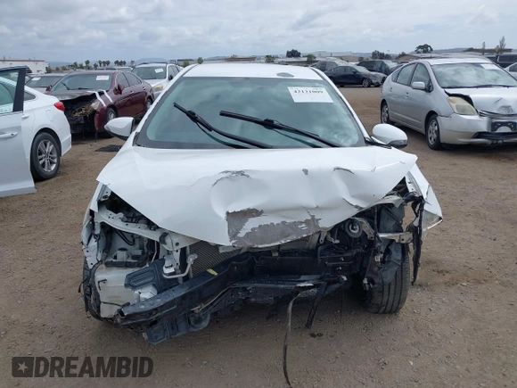 2014 Toyota Corolla L with VIN 5YFBURHE2EP085339, listed as a IAAI auction lot 42121009 with 122,339 mi miles and . Bid and sale history available at DreamBid. Image 13.