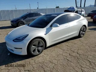 2020 Tesla Model 3 Standard Range Plus with VIN 5YJ3E1EA5LF660417, listed as a Copart auction lot 48144125 with 112,924 mi miles and Salvage Title. Bid and sale history available at DreamBid. Image 11.