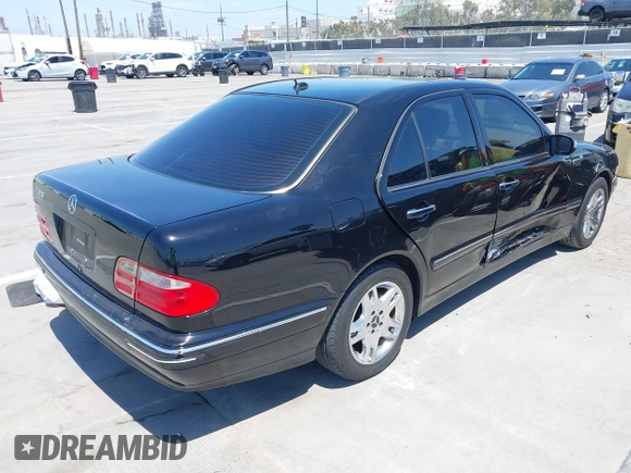 2002 Mercedes-Benz E-Class with VIN WDBJF65J62B404868, listed as a IAAI auction lot 42121837 with 107,415 mi miles. Bid and sale history available at carsss.com. Image 4.