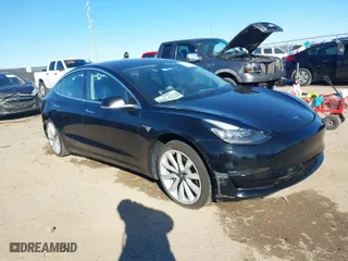 2018 Tesla Model 3 Long Range Battery with VIN 5YJ3E1EA2JF014975, listed as a IAAI auction lot 41319407 with 106,301 mi miles. Bid and sale history available at carsss.com. Image 1.
