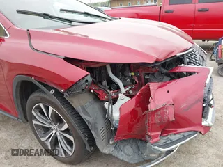 2022 Lexus RX 350 with VIN JTJHZMDAXN2058225, listed as a IAAI auction lot 42059802 with 63,407 mi miles and . Bid and sale history available at DreamBid. Image 6.