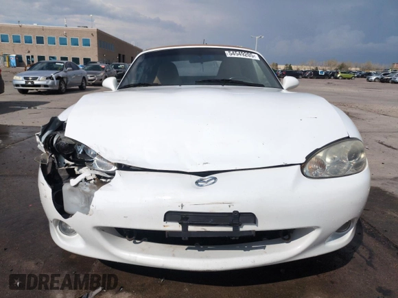 2002 Mazda MX-5 Miata Cloth z VIN JM1NB353X20229549, wystawiony jako Copart lot #54549205 z przebiegiem 79 871 mil mil oraz Szkoda całkowita • Salvage title. Historia ofert i sprzedaży dostępna na DreamBid. Obrazek 5.