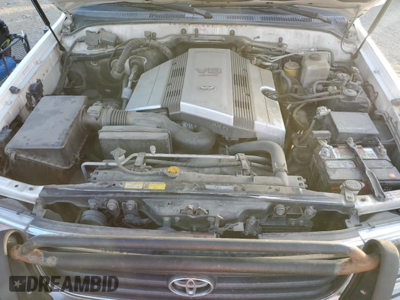 2000 Toyota Land Cruiser z VIN JT3HT05J0Y0122711, wystawiony jako Copart lot #86929954 z przebiegiem Nie podano mil oraz Czysty tytuł • Clean title. Historia ofert i sprzedaży dostępna na DreamBid. Obrazek 12.