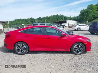 2016 Honda Civic EX-L z VIN 2HGFC1F74GH652090, wystawiony jako IAAI lot #42253881 z przebiegiem 127 863 mil mil oraz . Historia ofert i sprzedaży dostępna na DreamBid. Obrazek 13.