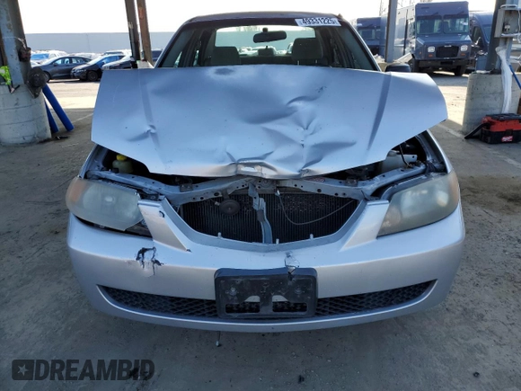2002 Mazda Protege DX with VIN JM1BJ225120605237, listed as a Copart auction lot 49331225 with 184,556 mi miles and Salvage Title. Bid and sale history available at DreamBid. Image 5.