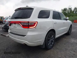 2014 Dodge Durango SXT with VIN 1C4RDJAG0EC561950, listed as a IAAI auction lot 42650331 with 106,959 mi miles and . Bid and sale history available at DreamBid. Image 4.