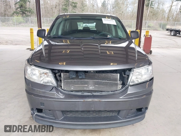 2015 Dodge Journey SE z VIN 3C4PDCAB1FT617794, wystawiony jako IAAI lot #41922371 z przebiegiem 130 558 mil mil oraz . Historia ofert i sprzedaży dostępna na DreamBid. Obrazek 13.