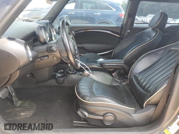 2012 MINI Hardtop S with VIN WMWSV3C50CTY18637, listed as a Copart auction lot 57771015 with 103,402 mi miles and Salvage title. Bid and sale history available at DreamBid. Image 7.